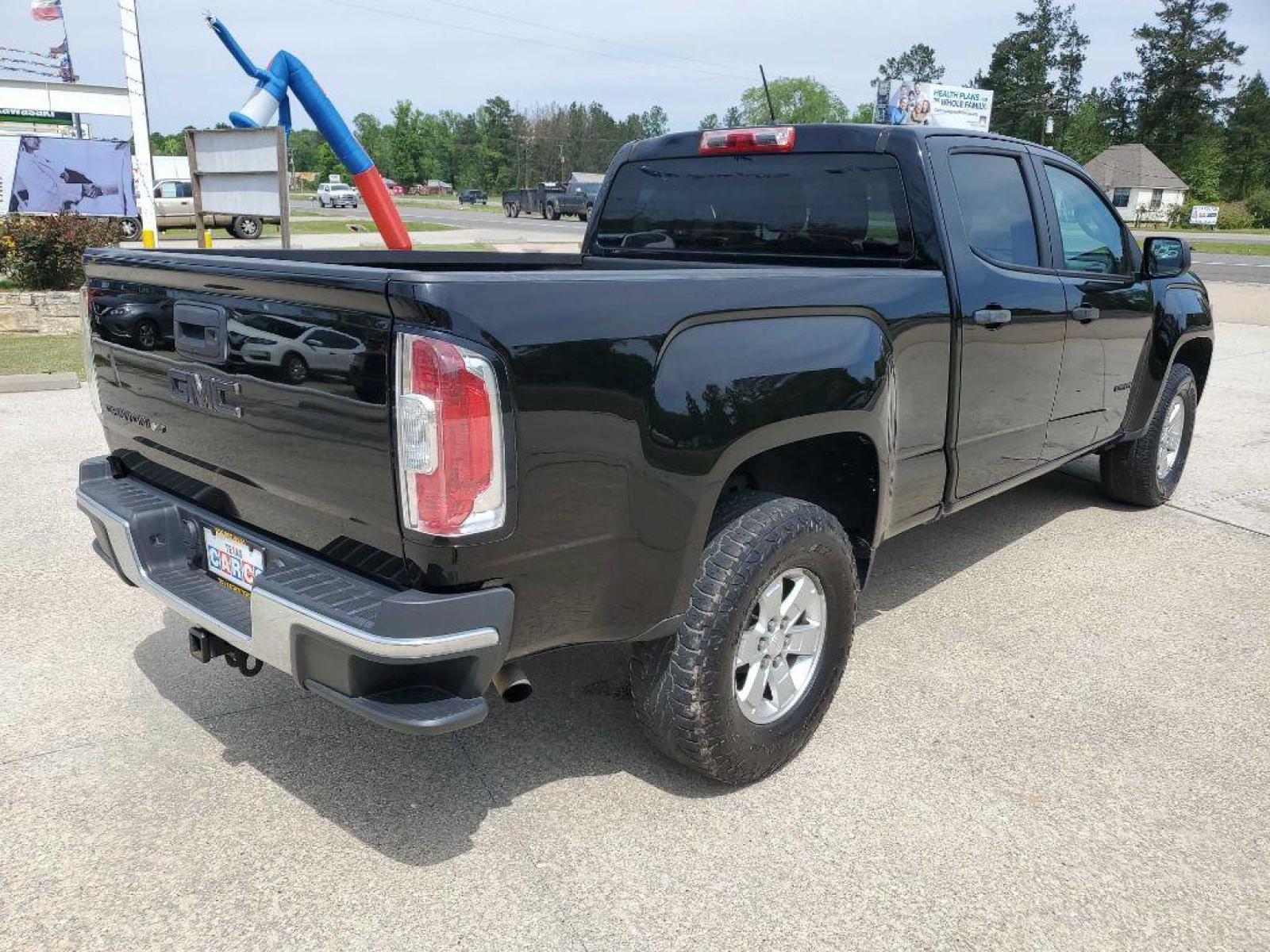2018 Black GMC CANYON (1GTG5BEN7J1) with an 3.6L engine, Automatic transmission, located at 3553 US Hwy 190 W., Livingston, TX, 77351, (936) 967-8141, 30.812162, -95.077309 - Photo #4