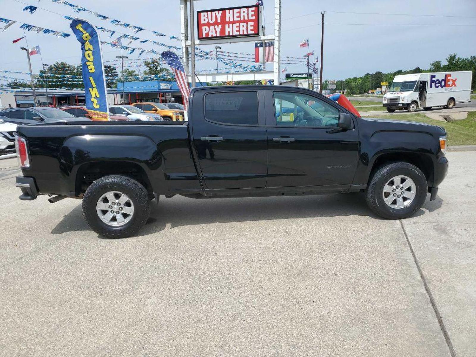 2018 Black GMC CANYON (1GTG5BEN7J1) with an 3.6L engine, Automatic transmission, located at 3553 US Hwy 190 W., Livingston, TX, 77351, (936) 967-8141, 30.812162, -95.077309 - Photo #5