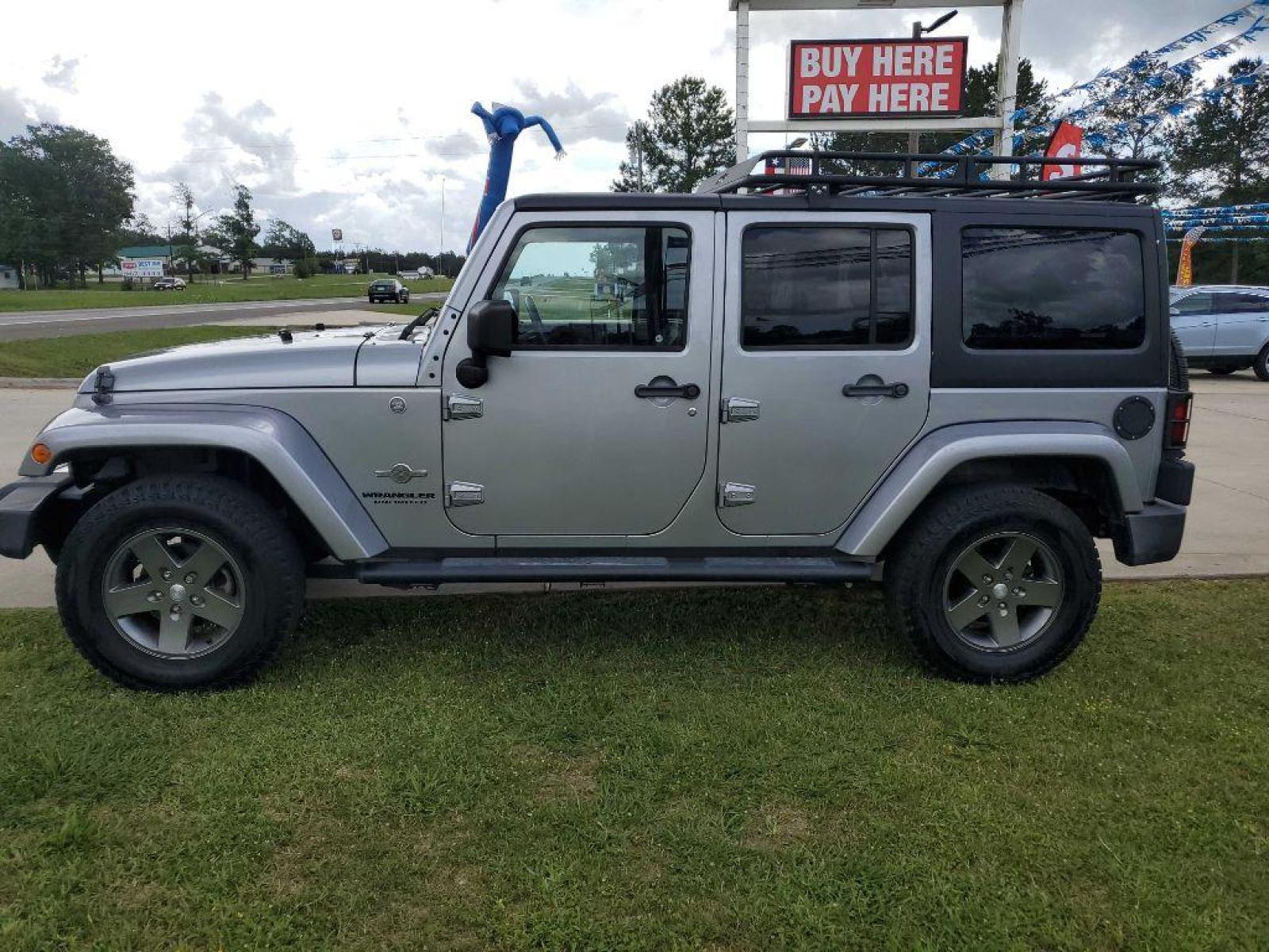 2013 Silver JEEP WRANGLER UNLIMI SPORT (1C4HJWDG8DL) with an 3.6L engine, Automatic transmission, located at 3553 US Hwy 190 W., Livingston, TX, 77351, (936) 967-8141, 30.812162, -95.077309 - Photo #1